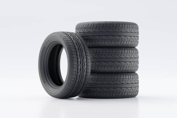 istock Stack of High-Performance Car Tires on a White Background 2205525729