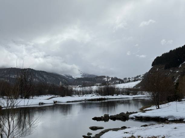 istock Serene Winter Landscape with Snow-Covered Riverbank 2205526883