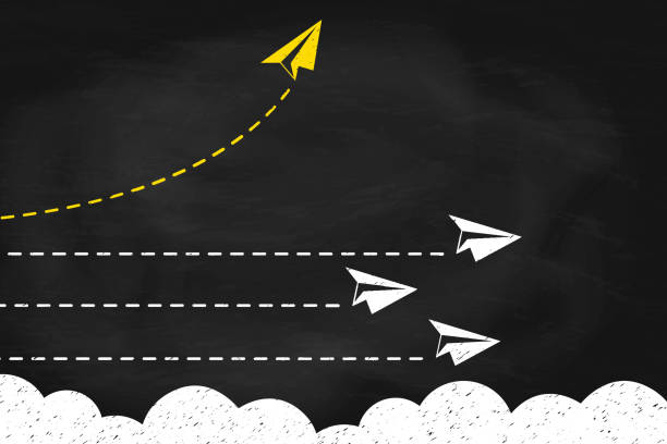 istock Yellow paper plane changing direction around the clouds on black chalkboard. New idea, change concept of business 2205527185