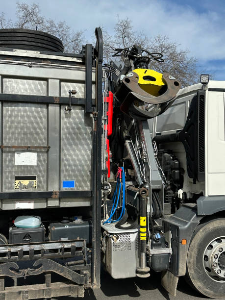 istock Side view of the garbage truck with crane 2205527393