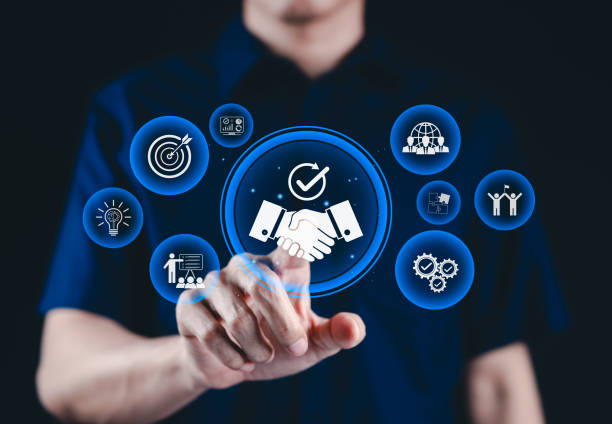 istock Trusted partnership and business collaboration concept. Businessman interact with digital handshake icons, represent trust, teamwork, successful collaboration in corporate partnerships, trustworthy, 2205527411