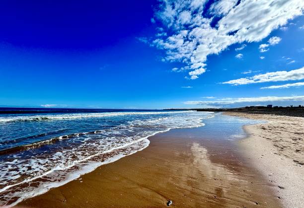 istock Blue sky and light clouds over Blyth beach in Northumberland 2205531106