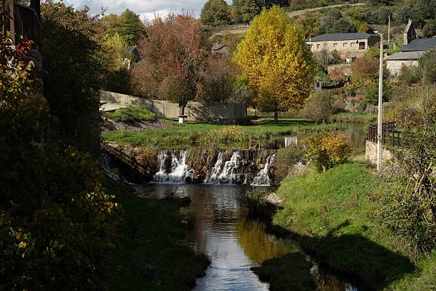 istock Countryside waterfall with autumn foliage 2205531194