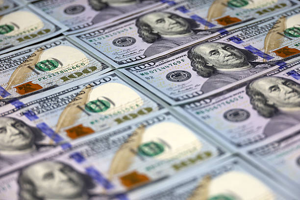 istock US dollar banknotes, paper currency for background 2205532723
