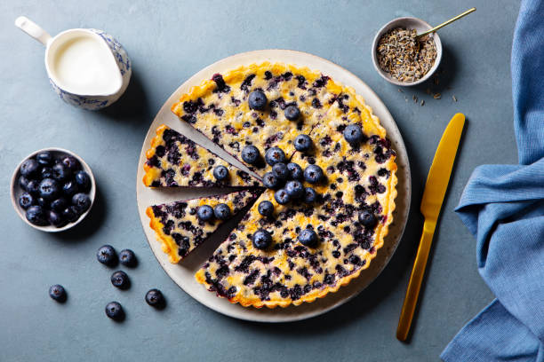 istock Blueberry tart with vanilla custard cream. Grey background. Close up. Top view. 2205533392