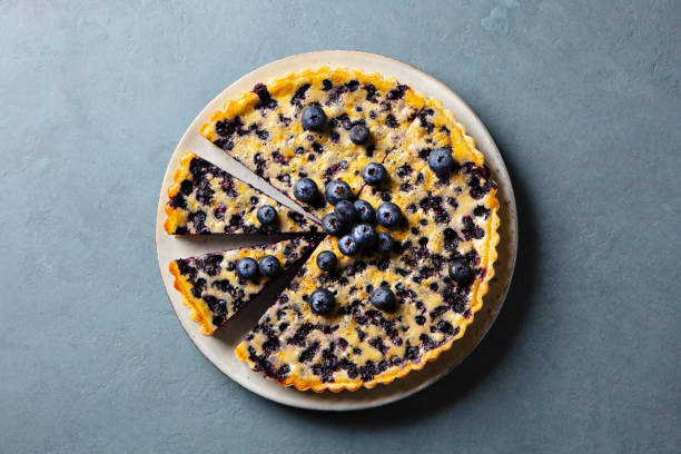 istock Blueberry tart with vanilla custard cream. Grey background. Close up. Top view. 2205533767