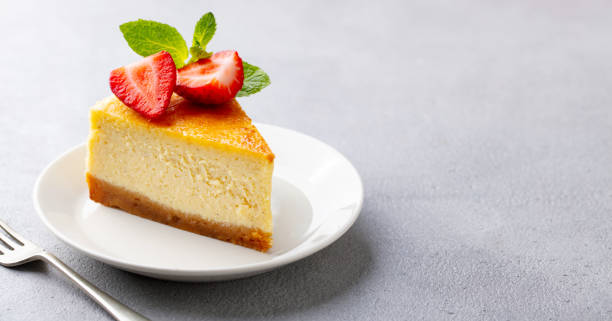 istock Cheesecake dessert with fresh strawberries. Grey background. Close up. Copy space. 2205533803