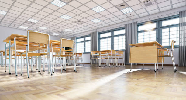 istock Empty classroom with wooden desks and chairs is waiting for students 2205534152