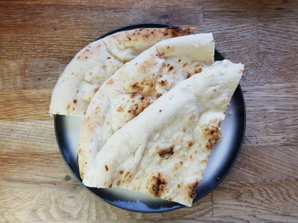istock Naan bread on a plate, Glasgow, Scotland 2205534182