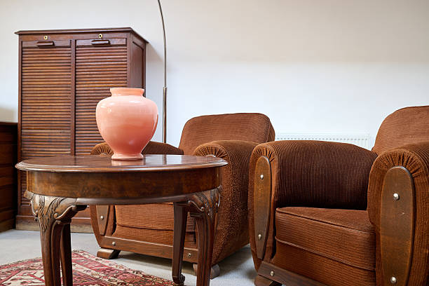 istock Loft with old fashionned table and sofa against white wall 2205536754