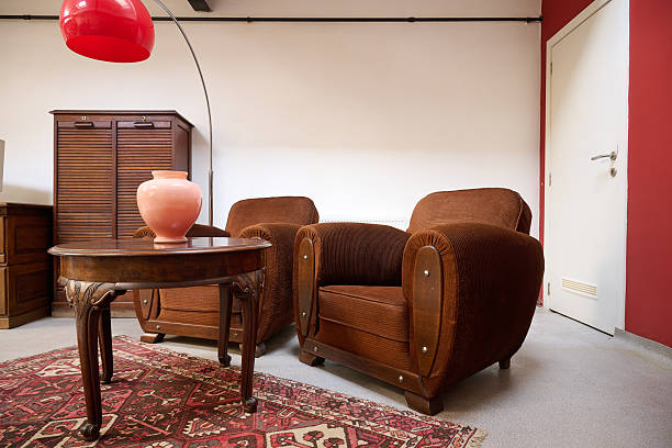 istock Loft with old fashionned table and sofa against white wall 2205536760