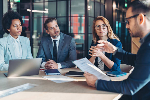 istock Business persons discussing a new contract 2205537103