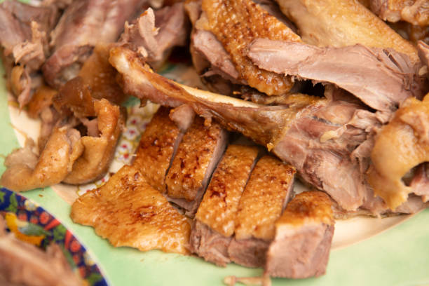 istock Sliced roast duck resting on a vintage plate 2205538158