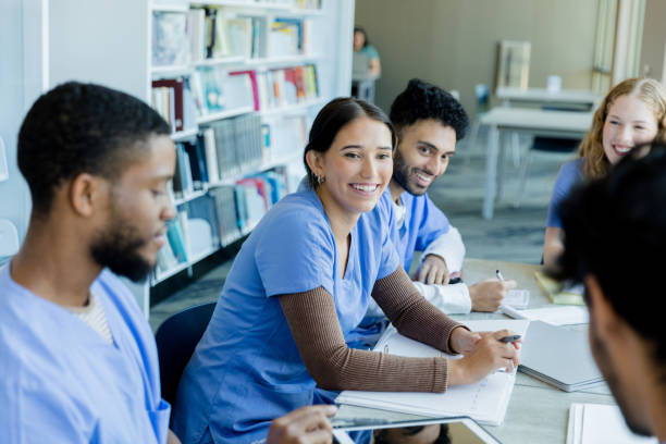 istock Multiracial Medical Students Studying Together in a Library 2205543792