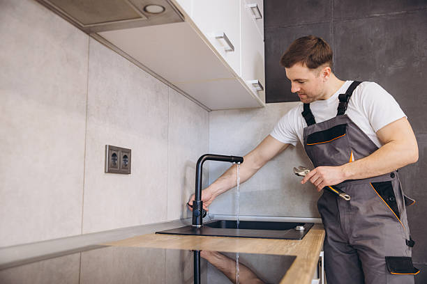 istock Plumber fixing kitchen faucet in modern apartment 2205544604