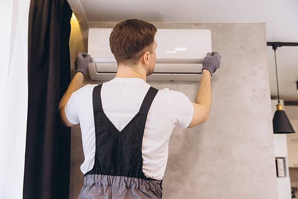istock Professional plumber installing modern air conditioner unit on wall 2205544773