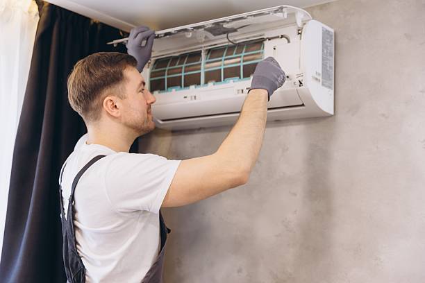 istock Plumber Installing or Repairing Air Conditioner Unit 2205544806