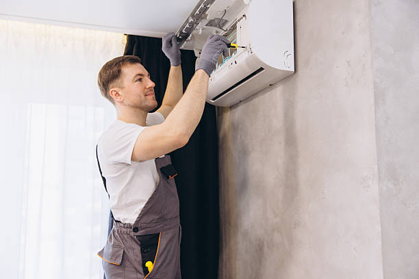 istock Professional plumber repairing air conditioner using screwdriver 2205544814