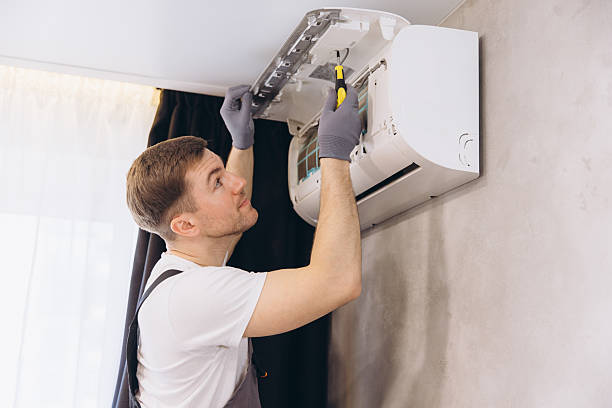 istock Professional plumber repairing modern air conditioner unit 2205544838