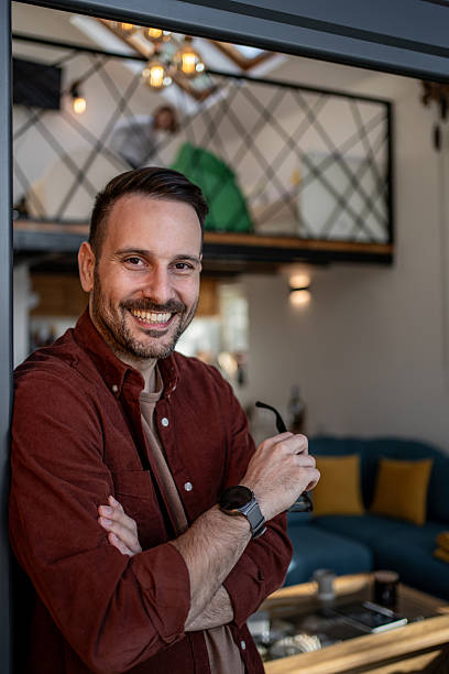 istock Portrait of smiling freelancer working from home office 2205545703