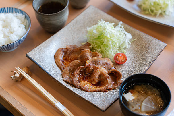 istock Grilled pork in soy sauce, served as a set with miso soup, cabbage, and rice. 2205547705