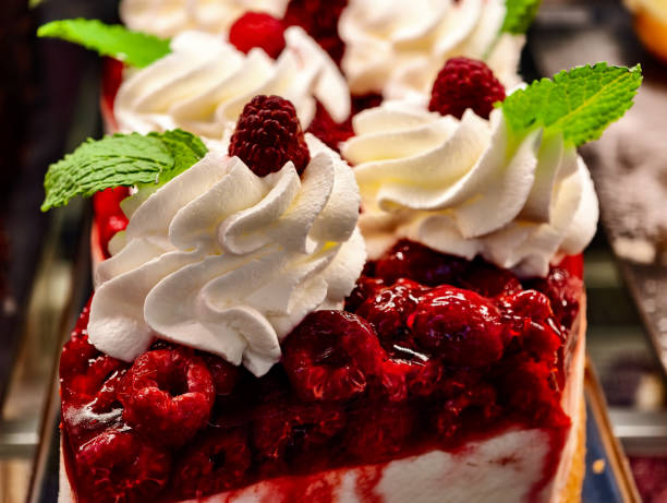 istock Raspberry Cheesecake Dessert Creamy Topping Fresh Berries Elegant Presentation Professional Food Photography Gourmet Patisserie Premium Baked Treat 2205548200