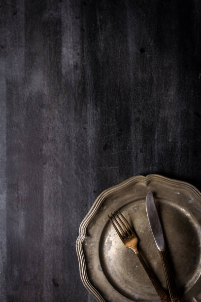 istock Vintage pewter plate and cutlery 2205550220