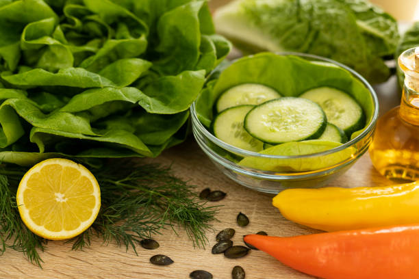 Vegetables from the garden. Ingathering. Making salad at home in the kitchen. High quality photo