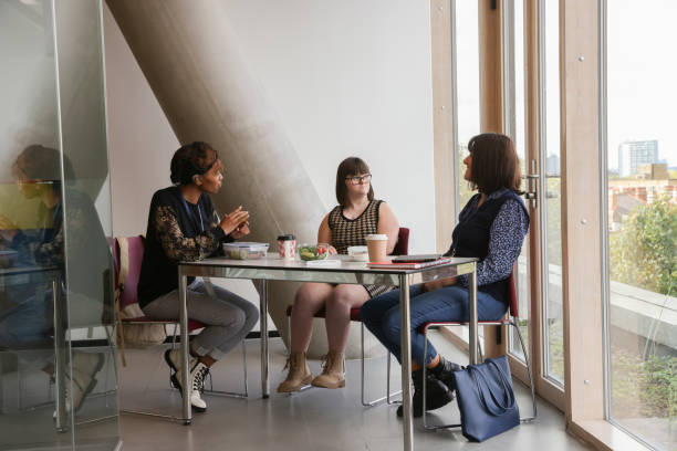 istock Women enjoying lunch in office 2205554169