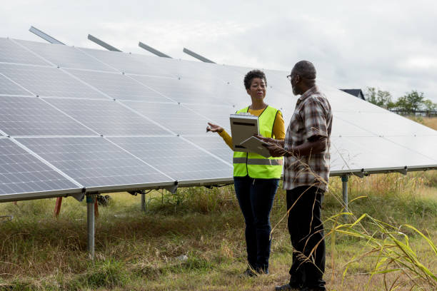 istock Diverse Team Inspecting Solar Panels for Sustainable Energy 2205558743