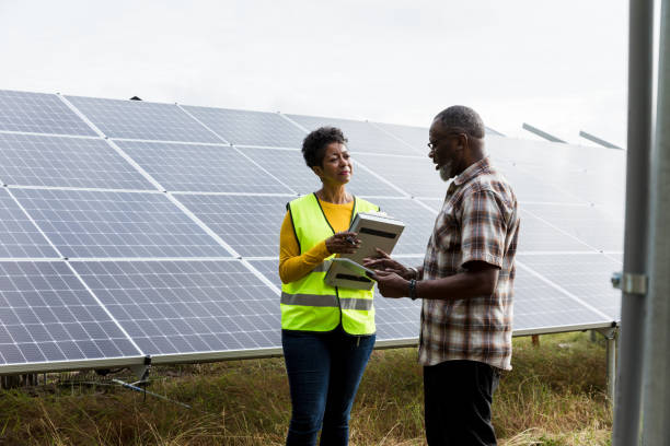 istock African American and Black Couple Working Together on Solar Panels 2205558747