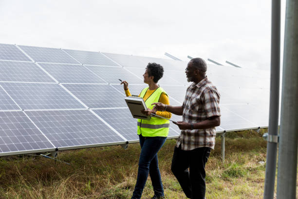 istock African American Couple Inspecting Solar Panels Together 2205558748