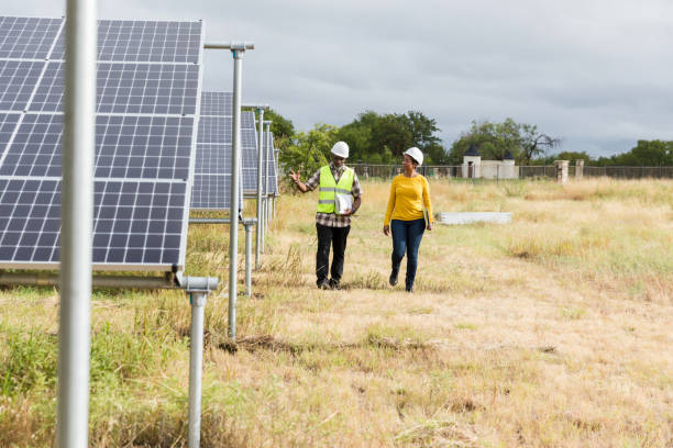 istock Diverse Engineers Inspecting Solar Panels in Texas Field 2205558776