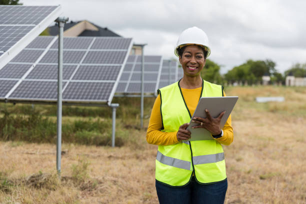 istock Confident Female Engineer Inspecting Solar Panels 2205558804