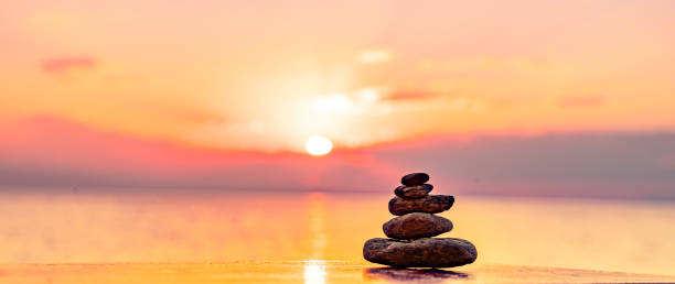 istock stone pyramid on a terrace by the sea 2205559670