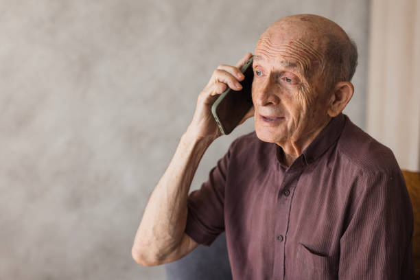 istock Senior man taking to phone 2205560969