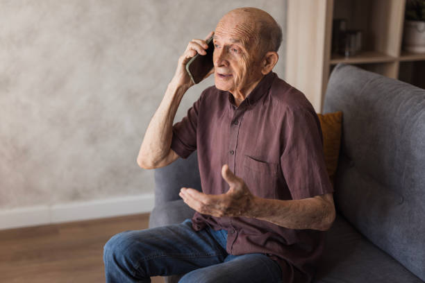 istock Senior man taking to phone 2205560990
