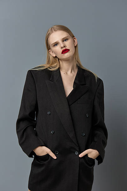 istock glamorous woman hand gesture black jacket makeup studio model unaltered 2205565941