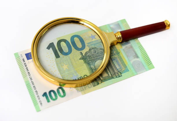 100 euro under the golden magnifying glass