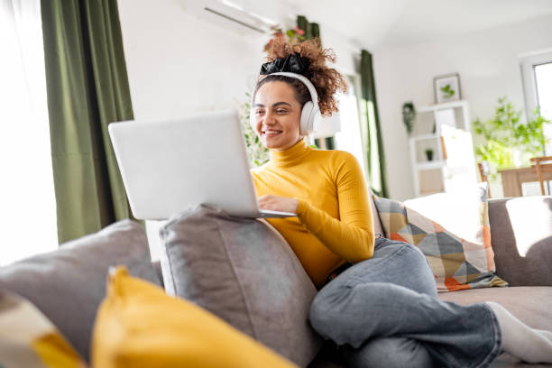 istock Happy Woman Communicating Online with Headphones 2205570384