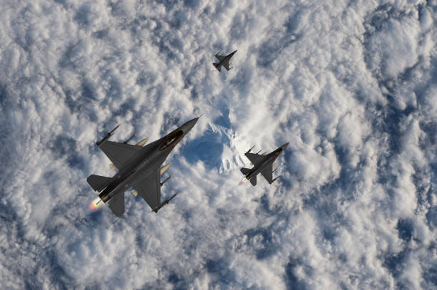 istock Air Force Fighter Jets flying over clouds. High Above The Clouds. 2205571791