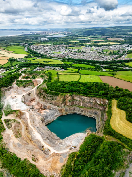 Cawfield Quarry by Hadrians Wall, Northumberland, with rocks in the foreground on a summer day