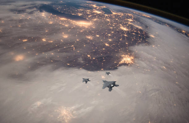 istock Air Force Fighter Jets flying over clouds. High Above The Clouds. 2205573642