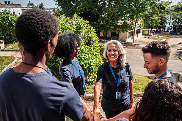istock Volunteers with hands togethers outdoors 2205574634