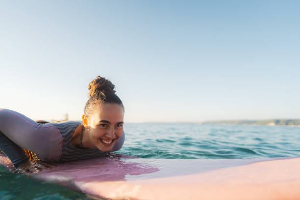 istock Surfer girl in the ocean 2205574762