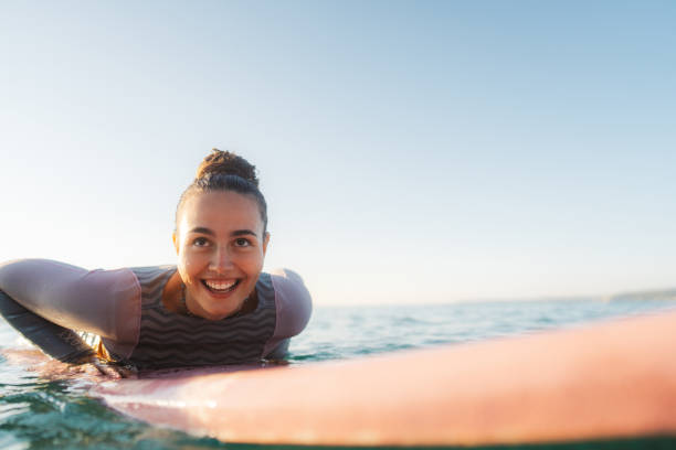 istock Surfer girl in the ocean 2205574833