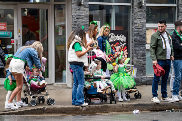 Spectators watching the St. Patrick's Day Parade 2025 in Toronto. Toronto, Canada - March 16, 2025.