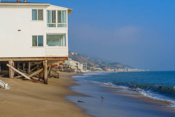 istock Seaside House on Stilts Overlooking Sandy Beach in Malibu 2205580197