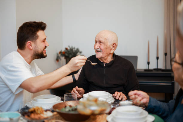 istock Senior Couple Enjoying Dinner Together 2205580306