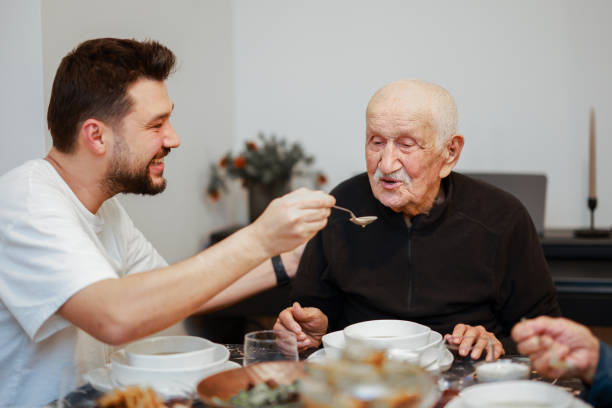 istock Senior Couple Enjoying Dinner Together 2205580569